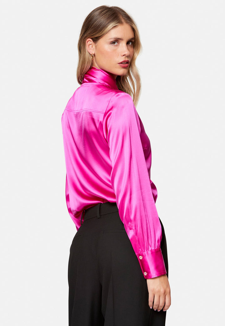 Woman wearing pink Silk Pussybow Blouse and black trouser