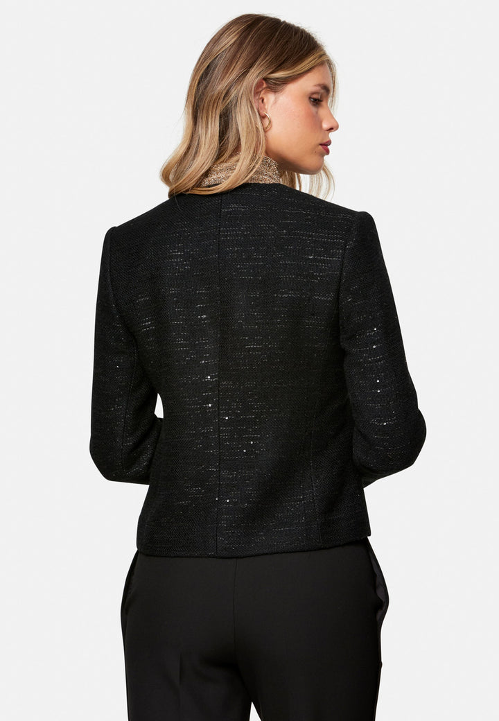 woman wearing black tweed jacket