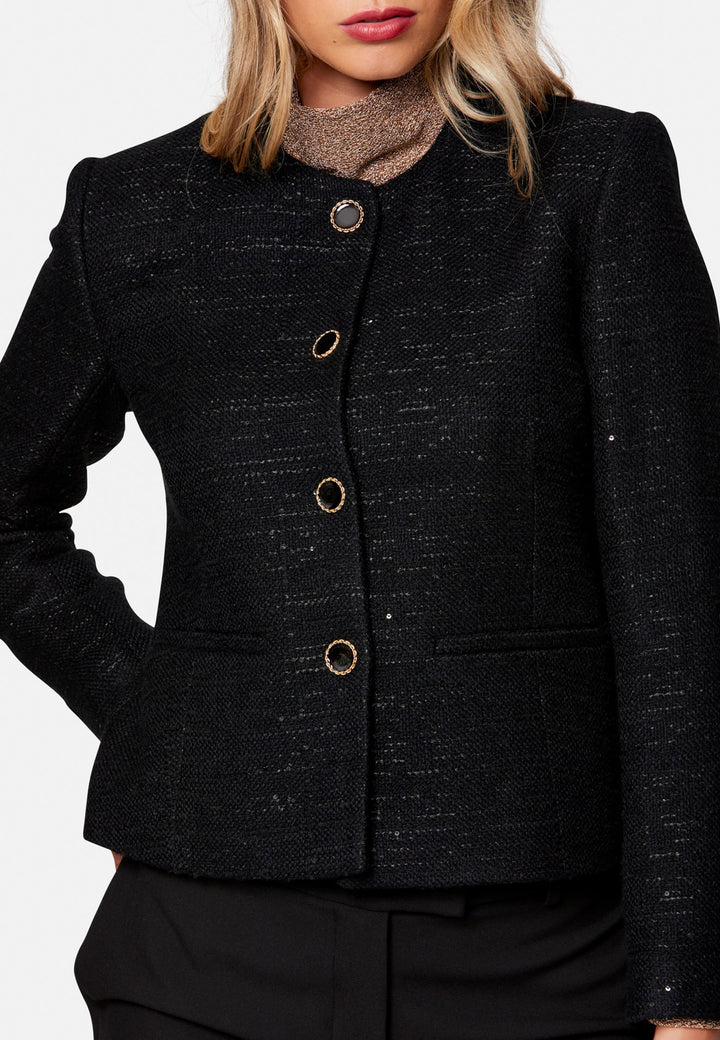 woman wearing black tweed jacket