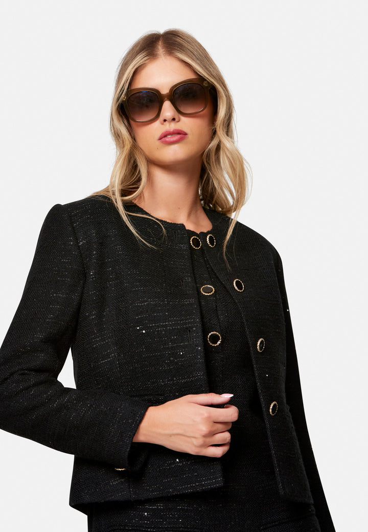 woman wearing black tweed jacket