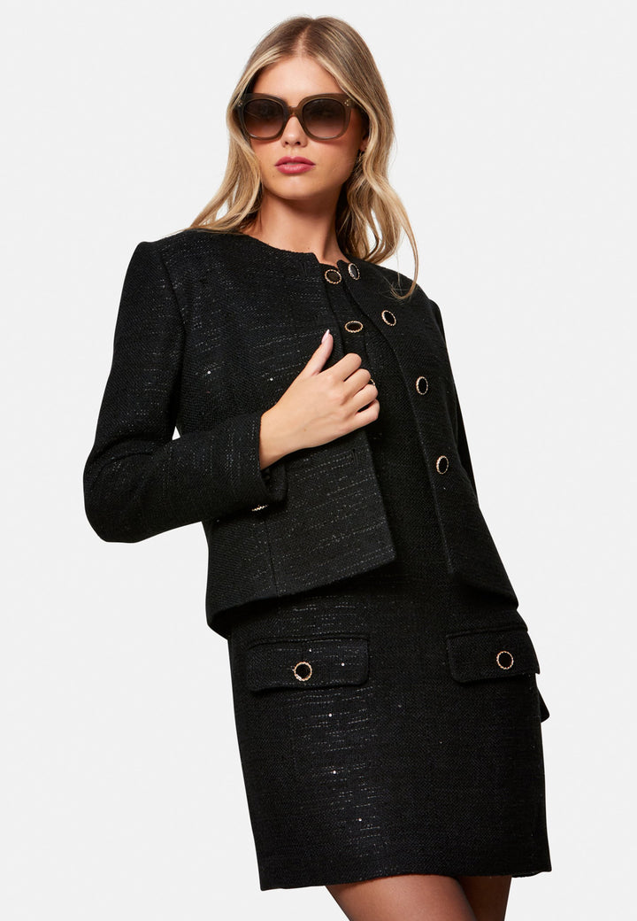 woman wearing black tweed jacket