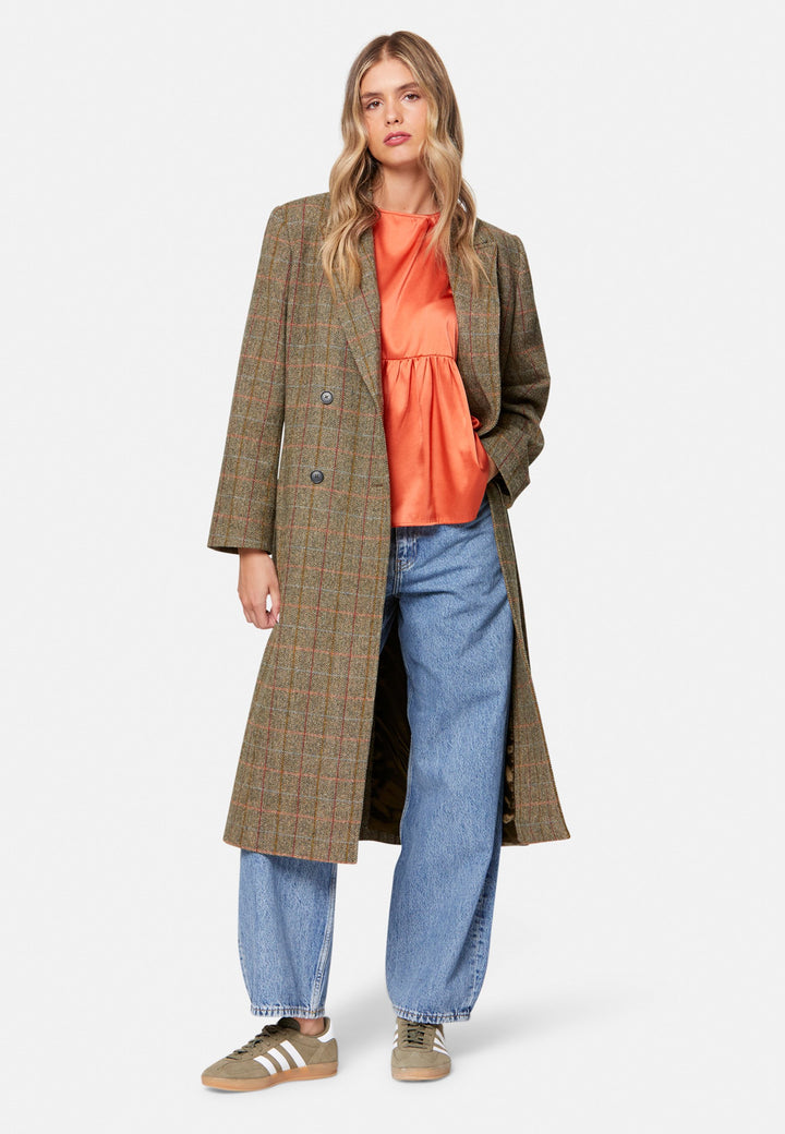 Woman wearing silk orange blouse