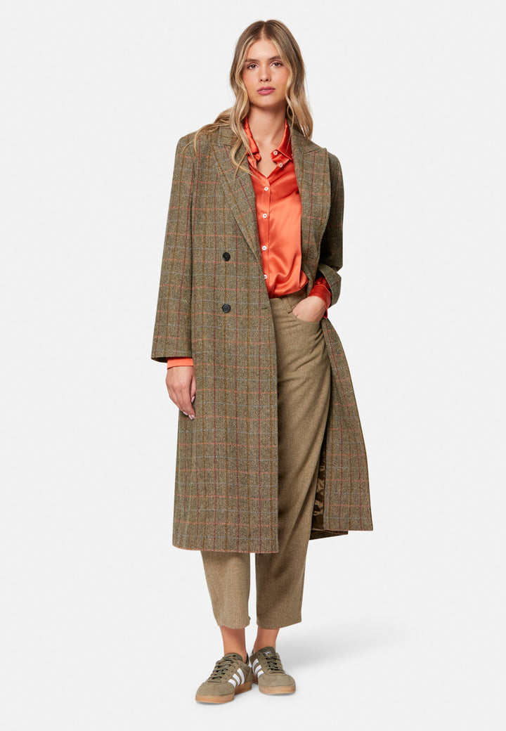 Woman wearing orange silk satin shirt