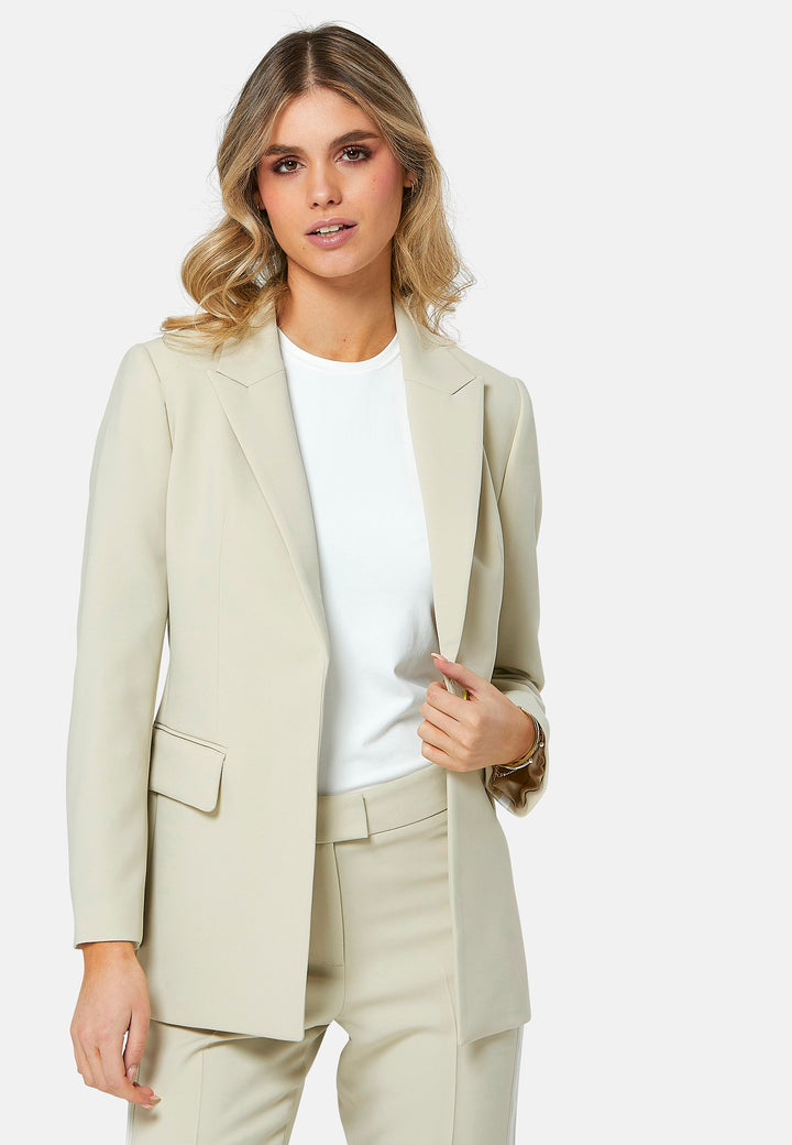 Jade offers a contemporary twist on the classic blazer, now available in a sophisticated bone hue to perfectly complement the matching trousers. This easy-fit jacket features a sporty white and bone stripe trim on the sleeve and cross back, adding a modern touch to its design. Crafted in our signature double crepe with a hint of stretch, Jade ensures both style and comfort, making it a versatile addition to your wardrobe.