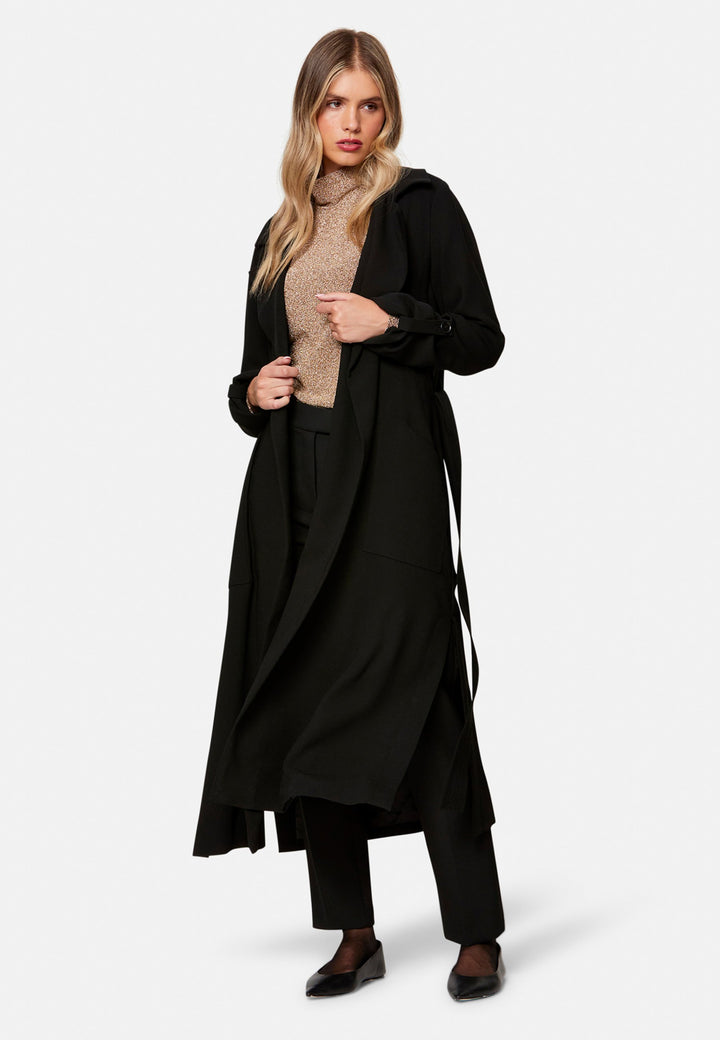 woman wearing black trench coat