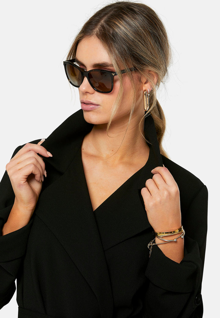 woman wearing black trench coat