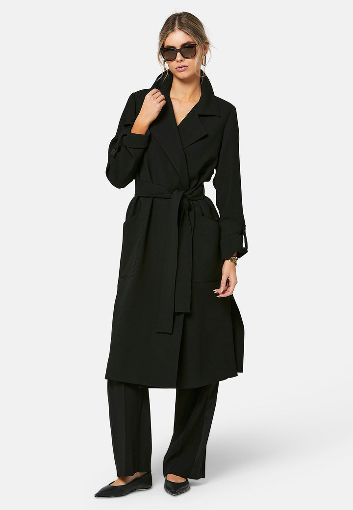 woman wearing black trench coat