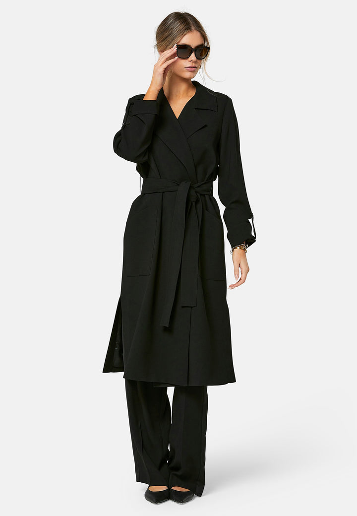 woman wearing black trench coat