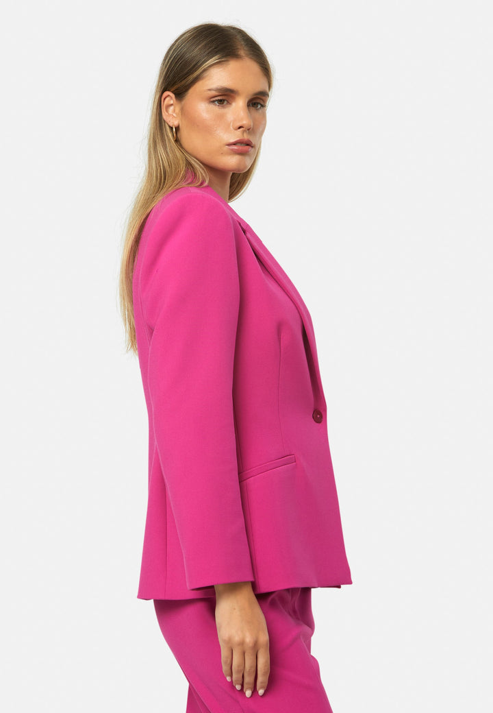 woman wearing pink suit