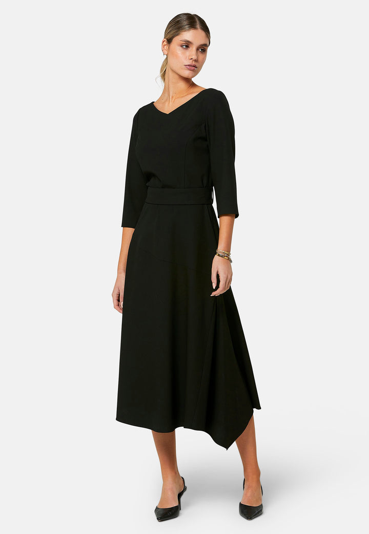 Odell, the perfect little black dress, designed in a fit and flare silhouette. Structured to the low waist, it features three-quarter sleeves, an asymmetrical hemline, and a detachable button-back belt. The flattering wide V-neckline makes it an elegant piece for any occasion.