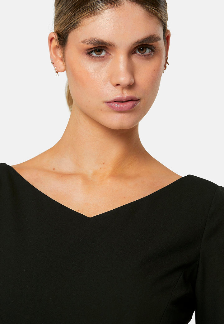 Odell, the perfect little black dress, designed in a fit and flare silhouette. Structured to the low waist, it features three-quarter sleeves, an asymmetrical hemline, and a detachable button-back belt. The flattering wide V-neckline makes it an elegant piece for any occasion.