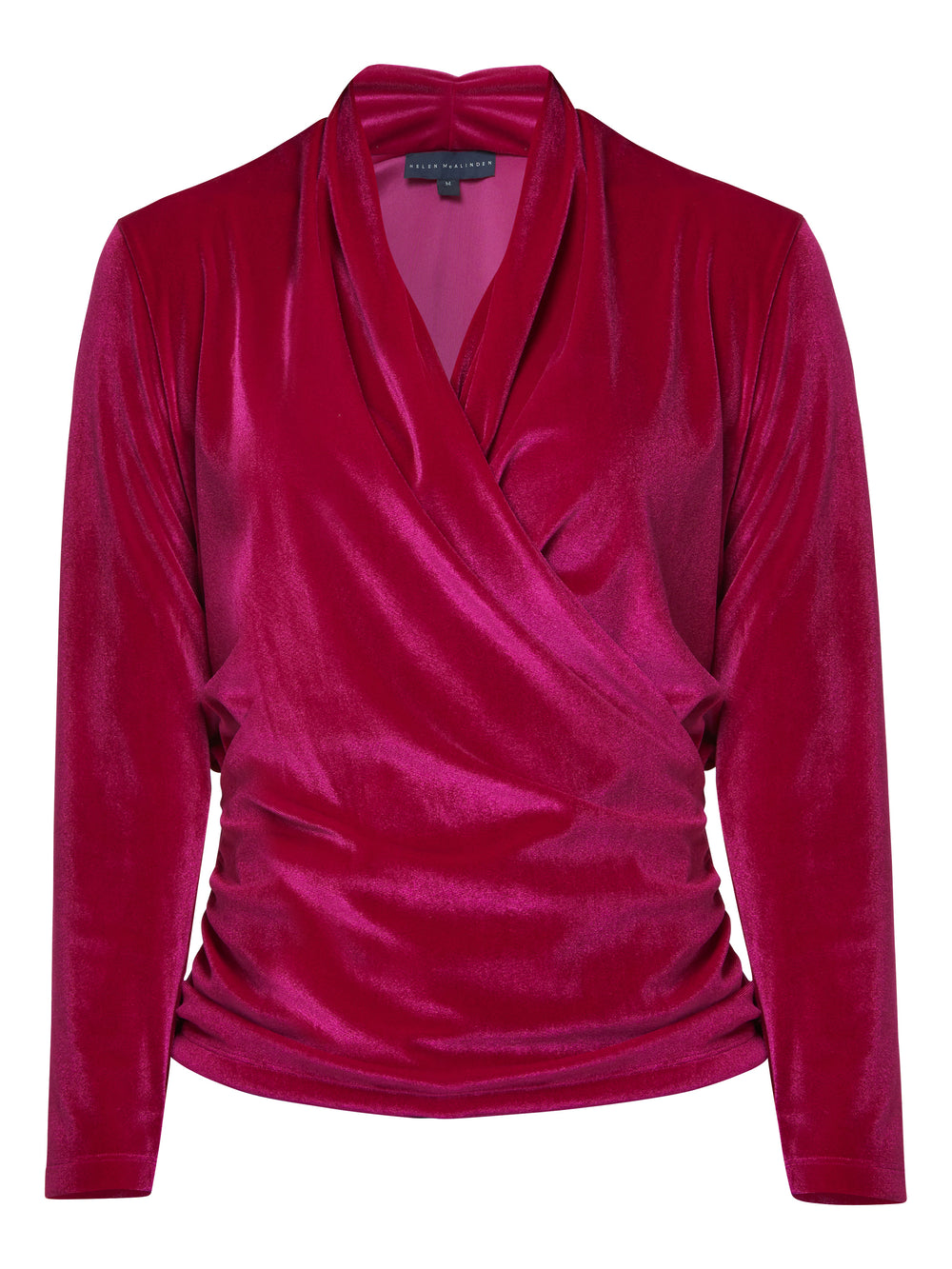 Introducing the Roxanne Fuchsia Velvet Top, an updated version of the beloved best-selling faux-wrap top. This captivating top boasts a sleek silhouette and a beautifully draped v-neckline, adding an elegant touch to your ensemble. Crafted from luxurious fuchsia stretch velvet, it radiates opulence and allure. With its hip-length cut and full-length sleeves, this top effortlessly combines comfort and style.