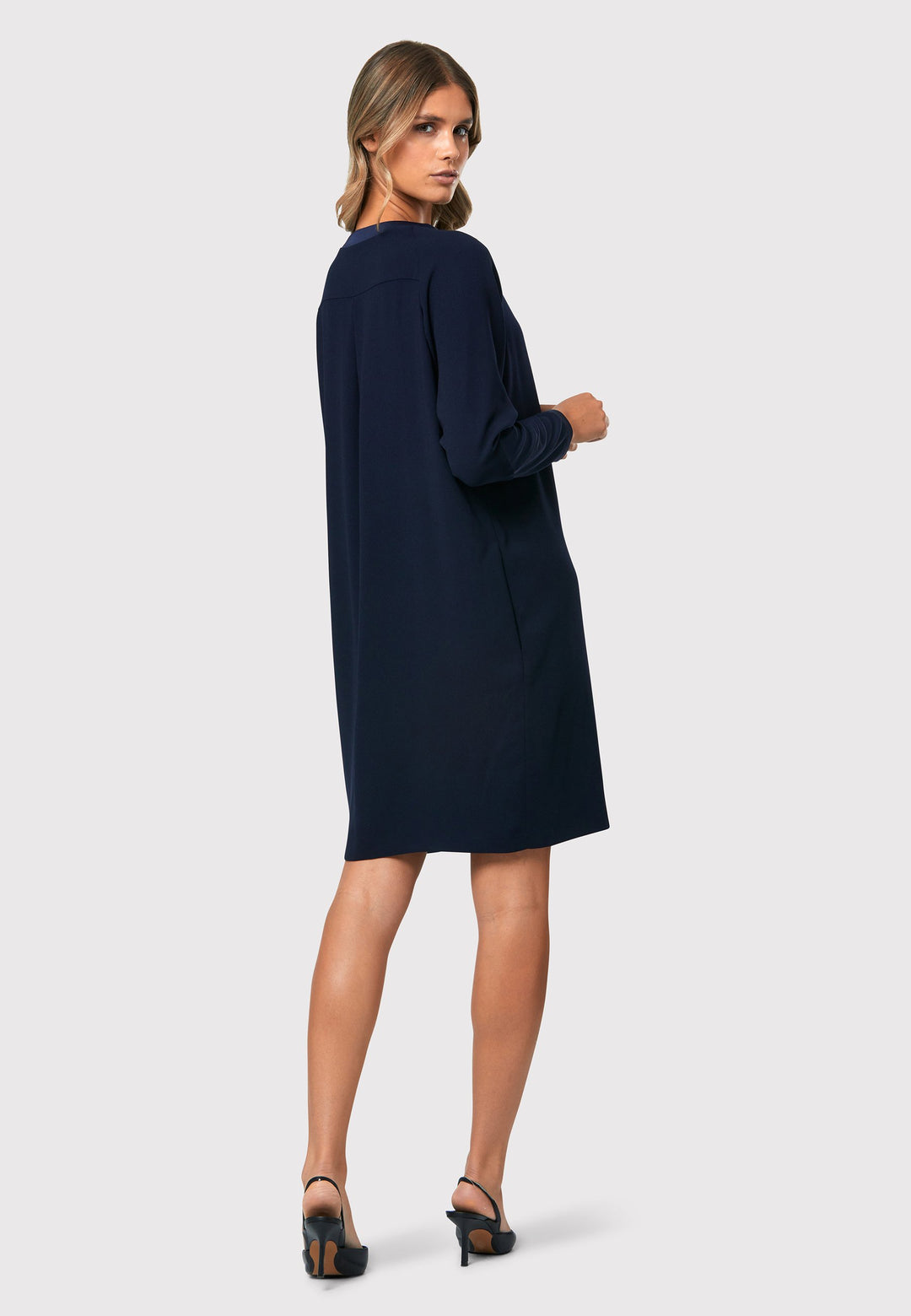  Adelaide Midnight Navy Dress, a knee-length ensemble that exudes timeless elegance. This chic dress features a satin cuff detail with an elegant point, adding a sophisticated touch to the design