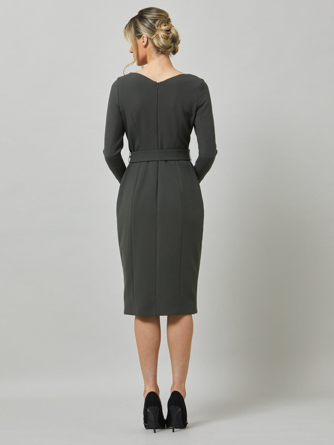 Celina, an elegant faux wrap pencil skirt dress in a smokey olive tone. Workwear redefined, the perfect desk to dinner dress. this body skimming silhouette falls below the knee and belted at the waist for a cinched profile, the ideal combination to accentuate the profile. Simply pair with heels for effortless elegance.