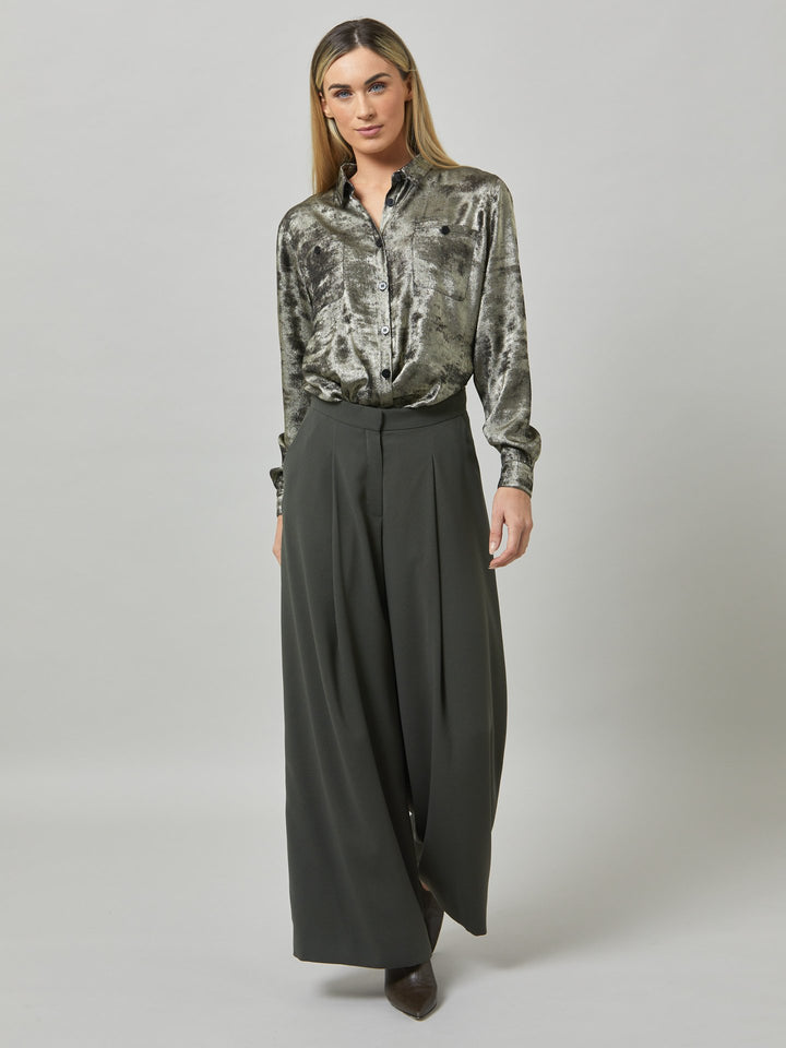 Charlize, a wide-leg palazzo pant. crafted in a satin back crepe in rich olive features deep pleats, sharp front crease & side pockets. A high-waisted trouser made to take you from desk to dinner with a relaxed & refined silhouette. Style with flats or dress up with heels.