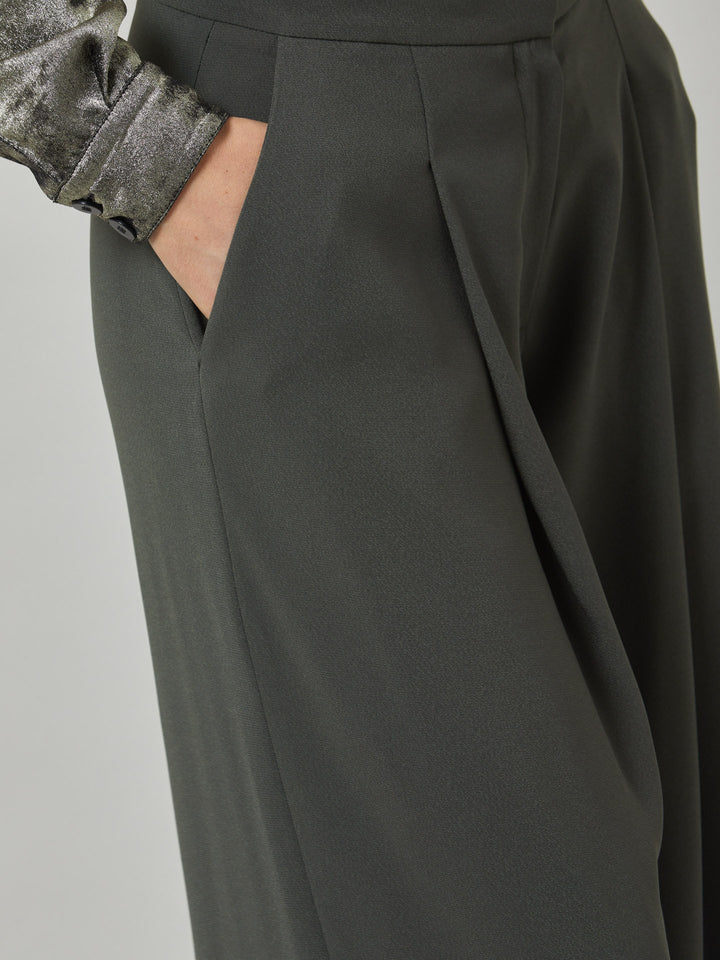 Charlize, a wide-leg palazzo pant. crafted in a satin back crepe in rich olive features deep pleats, sharp front crease & side pockets. A high-waisted trouser made to take you from desk to dinner with a relaxed & refined silhouette. Style with flats or dress up with heels.