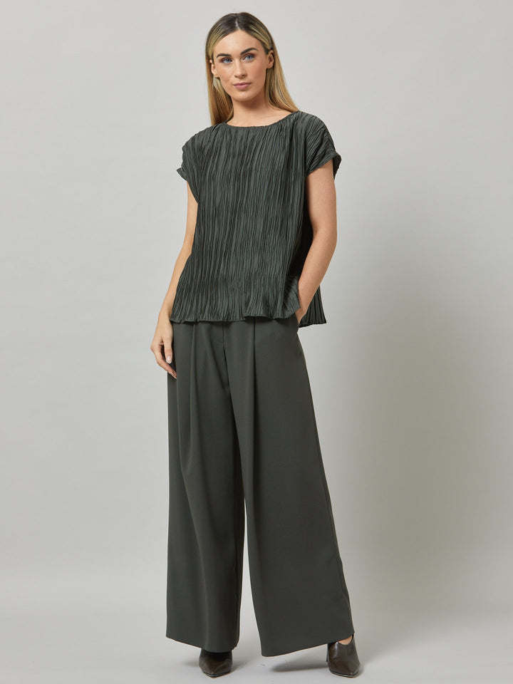 Charlize, a wide-leg palazzo pant. crafted in a satin back crepe in rich olive features deep pleats, sharp front crease & side pockets. A high-waisted trouser made to take you from desk to dinner with a relaxed & refined silhouette. Style with flats or dress up with heels.