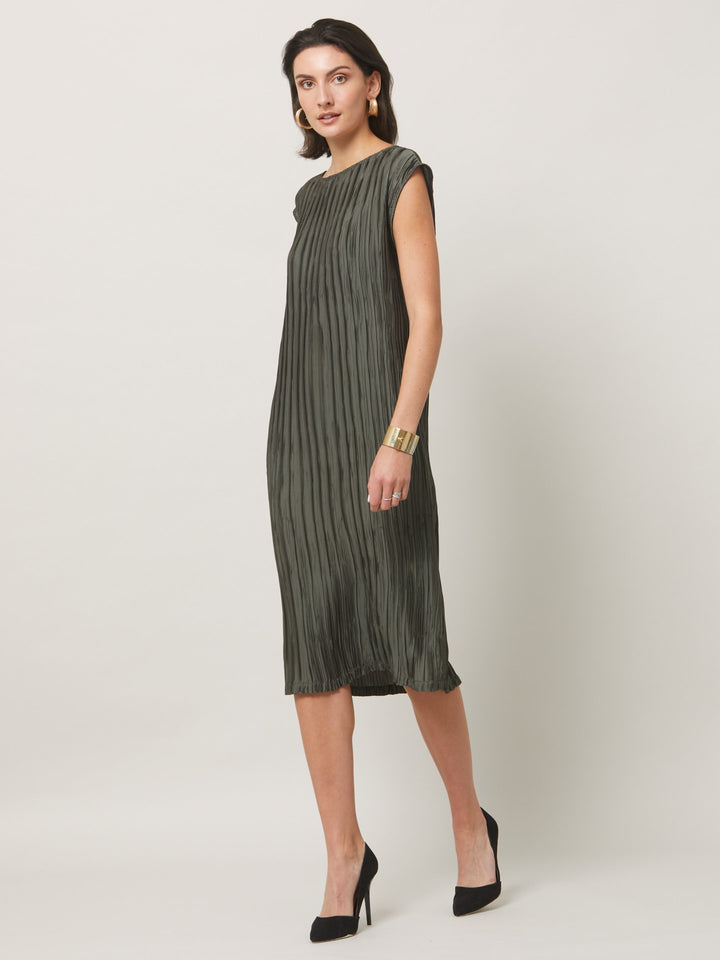 Dress for the occasion in the gemma dress. cut in an olive polished pleated fabric with contrasting satin band across the mid-riff, the ideal combination to accentuate the profile. An easy-fitting silhouette that falls to the mid-calf, features pockets and an elegant key-hole back neck detail. simply pair with heels for effortless elegance.