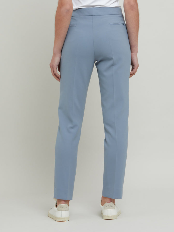 Jill, an investment worthy, neat narrow-leg trouser crafted in our signature double crepe with a hint of stretch. A wardrobe staple & HMcA classic. This season in a sophisticated smoky blue. Designed in Ireland by Helen McAlinden. Made in Europe. Free shipping to the EU & UK.