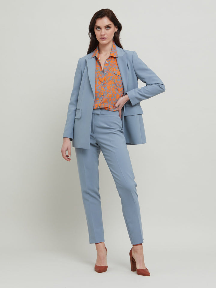 Jill, an investment worthy, neat narrow-leg trouser crafted in our signature double crepe with a hint of stretch. A wardrobe staple & HMcA classic. This season in a sophisticated smoky blue. Designed in Ireland by Helen McAlinden. Made in Europe. Free shipping to the EU & UK.