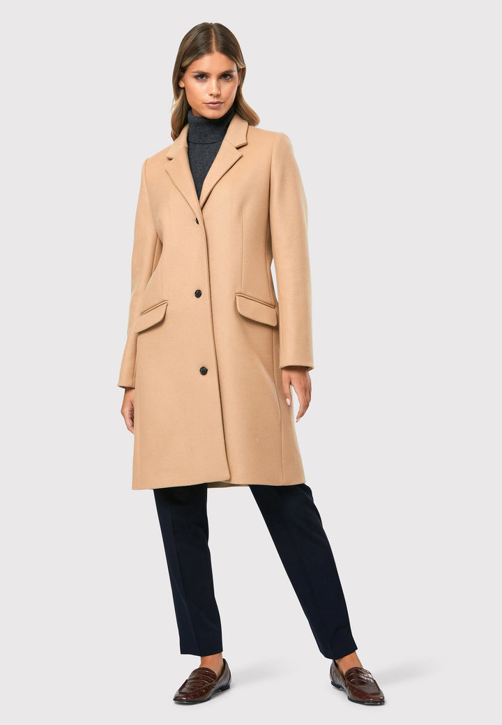 Expertly crafted from a luxurious wool and cashmere blend melton, this knee-length coat offers both warmth and sophistication. It showcases a tidy collar and revere design. With a three-button finish and practical pockets, this coat effortlessly combines functionality with style. 