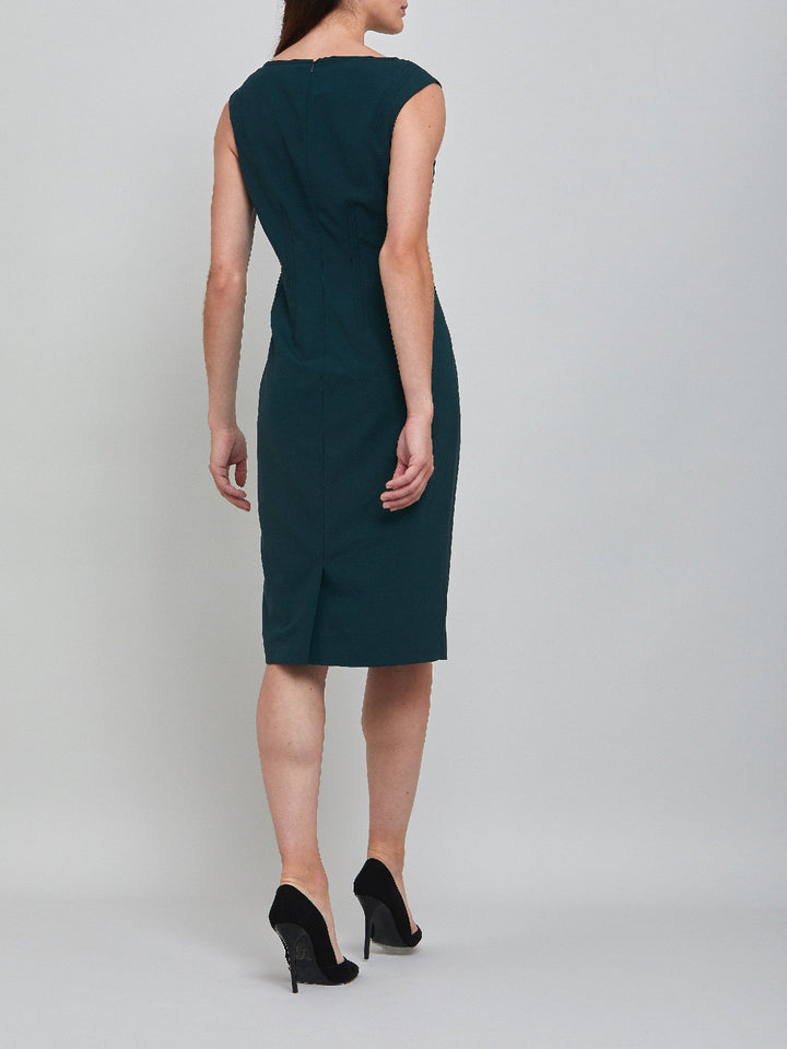 Livia, an elegant sleeveless dress, fabricated in woolen crepe. An expertly tailored form-flattering silhouette that falls right over the knee, with a hint of elastane to ensure comfort & ease of movement. 