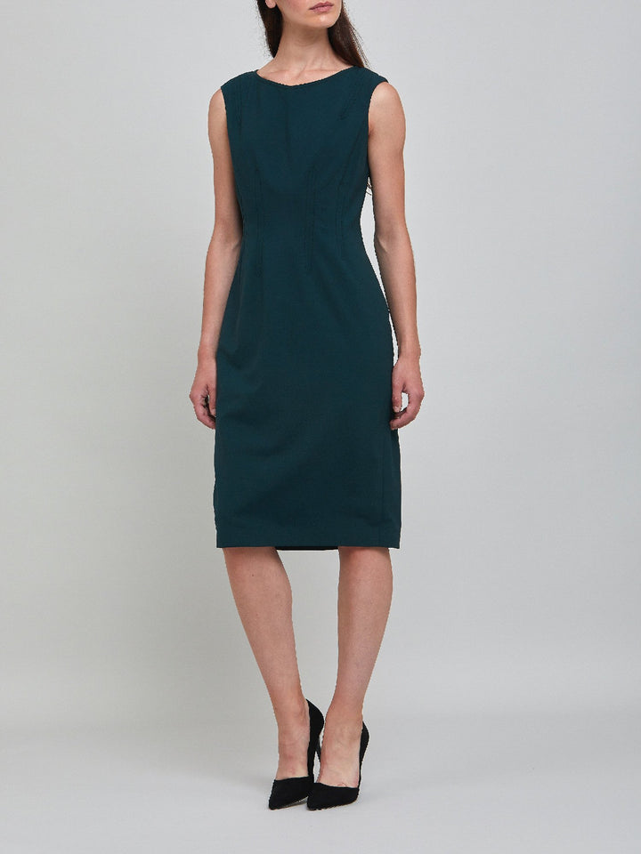 Livia, an elegant sleeveless dress, fabricated in woolen crepe. An expertly tailored form-flattering silhouette that falls right over the knee, with a hint of elastane to ensure comfort & ease of movement. 