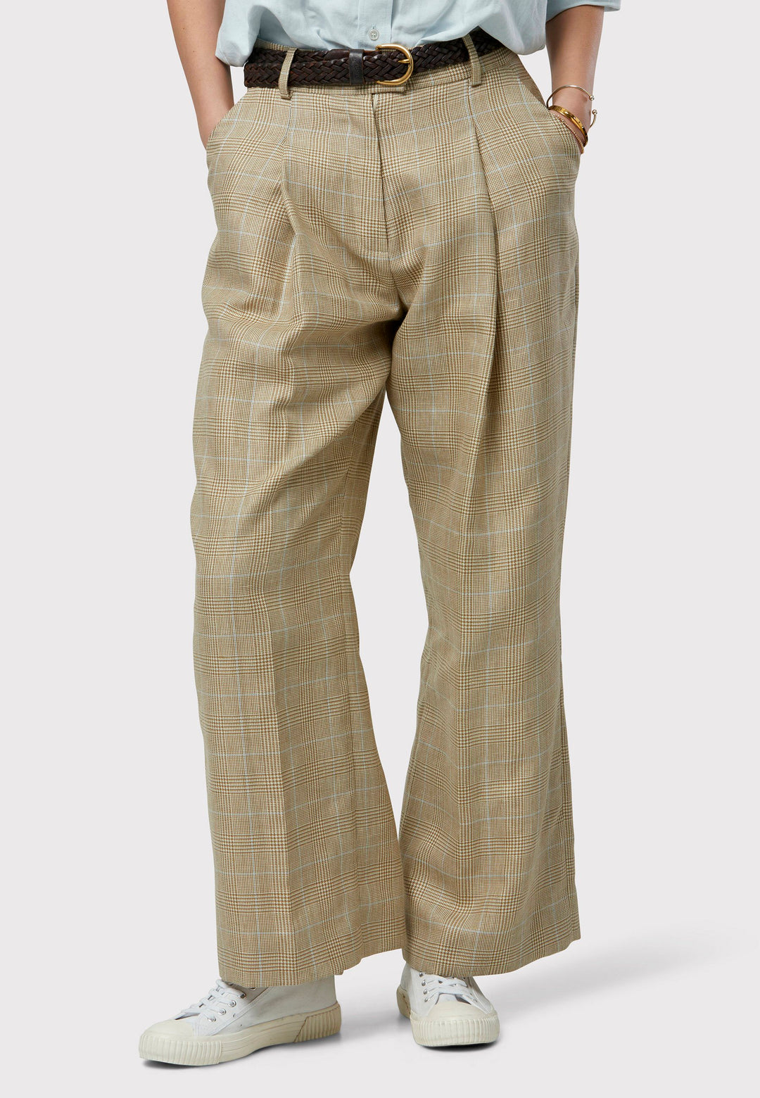 Introducing the Lyra Glencheck Pants: Embrace summer sophistication with these trousers featuring a cream, beige, white, and baby blue tweed pattern. The Lyra Glencheck Pants present a relaxed yet refined silhouette, offering wide-leg styling with pleat front details for added flair. Crafted from a premium tweed blend, they strike the perfect balance between comfort and style.