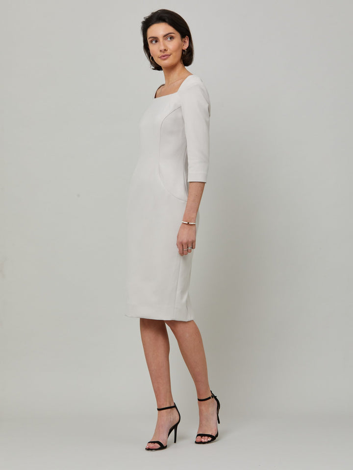 Introducing Mia, a body-skimming dress in a sophisticated latte. The dress features a flattering square neck and falls to a demure finish below the knee. Simple and refined elegance at its best. Attending a summer wedding? Mother of the bride? Heading to the races? This is the dress for you.