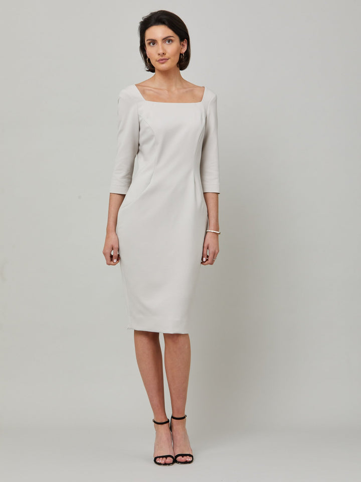 Introducing Mia, a body-skimming dress in a sophisticated latte. The dress features a flattering square neck and falls to a demure finish below the knee. Simple and refined elegance at its best. Attending a summer wedding? Mother of the bride? Heading to the races? This is the dress for you.