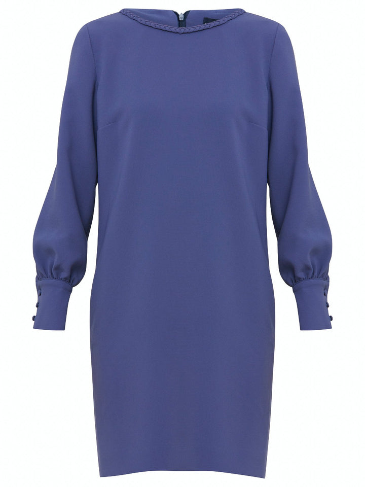 Rachel, a contemporary form-flattering shift dress. Crafted in a juniper blue tricotine with a hint of stretch. The round neck features an elegant plait trim & the easy-fitting sleeve softly gathers into a buttoned cuff. The skirt skims the knee. Work, Wine, or Dine in the Rachel Dress.