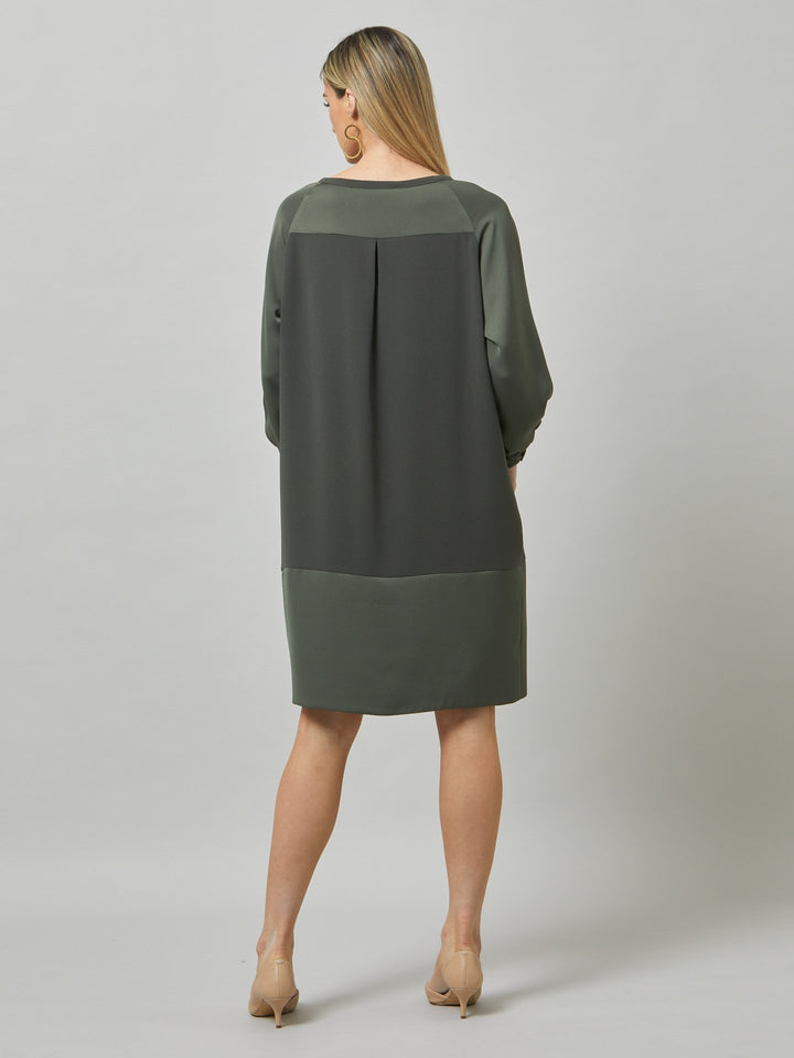 Introducing Sarah, a chic and effortlessly stylish shift dress that brings a fresh perspective to occasion wear. Crafted from luxurious olive satin back crepe, it offers a simple and easy-fit silhouette. The satin raglan sleeves add a touch of sophistication, while the deep satin band at the hem enhances the overall elegance. With convenient side seam pockets, Sarah provides both comfort and functionality. Embrace the versatility and timeless appeal of this dress, perfect for various occasions.