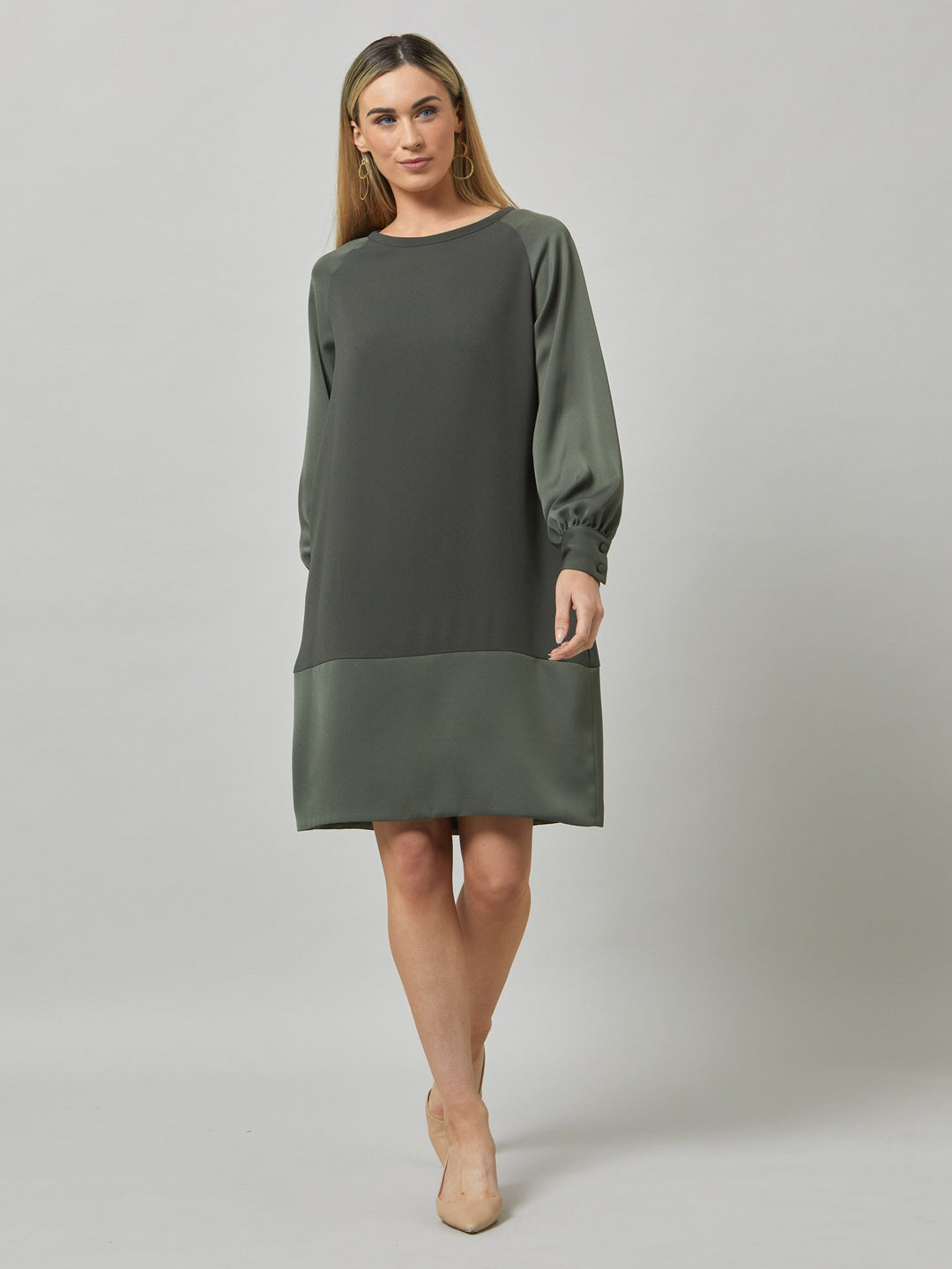 Introducing Sarah, a chic and effortlessly stylish shift dress that brings a fresh perspective to occasion wear. Crafted from luxurious olive satin back crepe, it offers a simple and easy-fit silhouette. The satin raglan sleeves add a touch of sophistication, while the deep satin band at the hem enhances the overall elegance. With convenient side seam pockets, Sarah provides both comfort and functionality. Embrace the versatility and timeless appeal of this dress, perfect for various occasions.