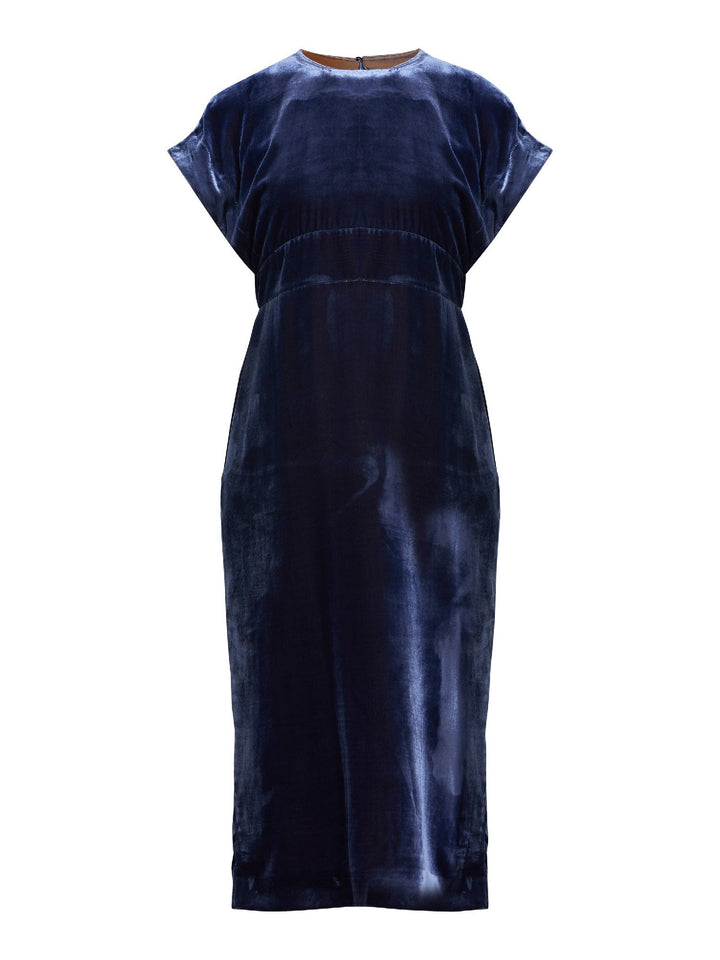 Occasionwear modernized. Meet the Shiv Juniper blue dress in Luxurious fluid velvet. An easy-fitting silhouette with side seam pockets falls to the mid-calf & features a side slit, dropped sleeves, and an elegant key-hole back neck detail. Attending a winter wedding? This is the dress for you.