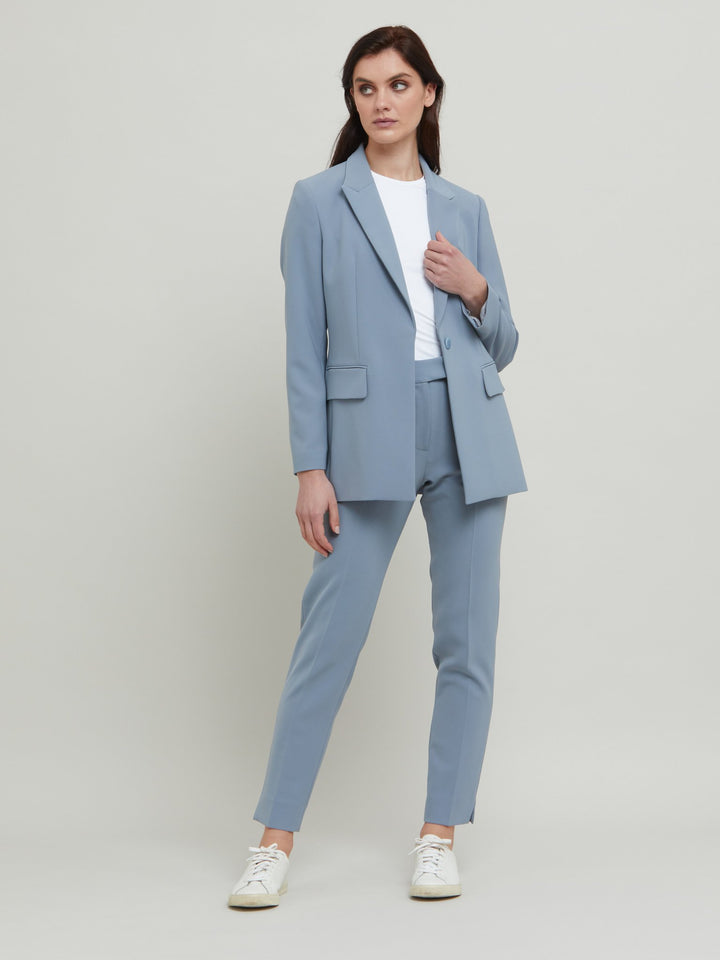 Tina, the most elegant of jackets. A classic semi-fitted silhouette in a sophisticated smoky blue with lapel collar, flap pockets, lined and tailored with a one-button fastening. Designed in Ireland by Helen McAlinden. Made in Europe. Free shipping to the EU & UK.