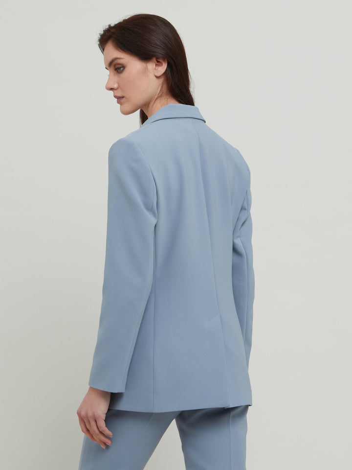 Tina, the most elegant of jackets. A classic semi-fitted silhouette in a sophisticated smoky blue with lapel collar, flap pockets, lined and tailored with a one-button fastening. Designed in Ireland by Helen McAlinden. Made in Europe. Free shipping to the EU & UK.