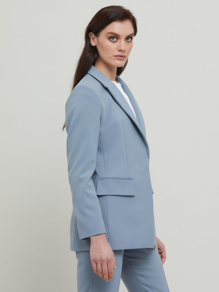 Tina, the most elegant of jackets. A classic semi-fitted silhouette in a sophisticated smoky blue with lapel collar, flap pockets, lined and tailored with a one-button fastening. Designed in Ireland by Helen McAlinden. Made in Europe. Free shipping to the EU & UK.