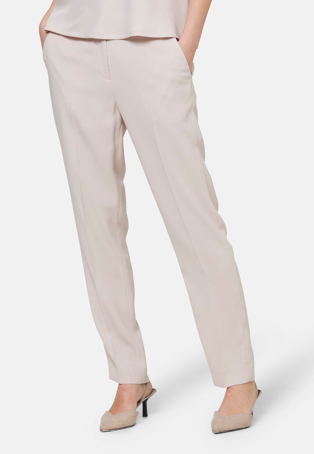 Woman wearing natural pearl pants