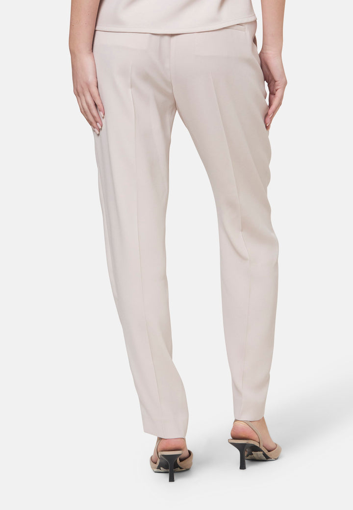 Woman wearing natural pearl pants