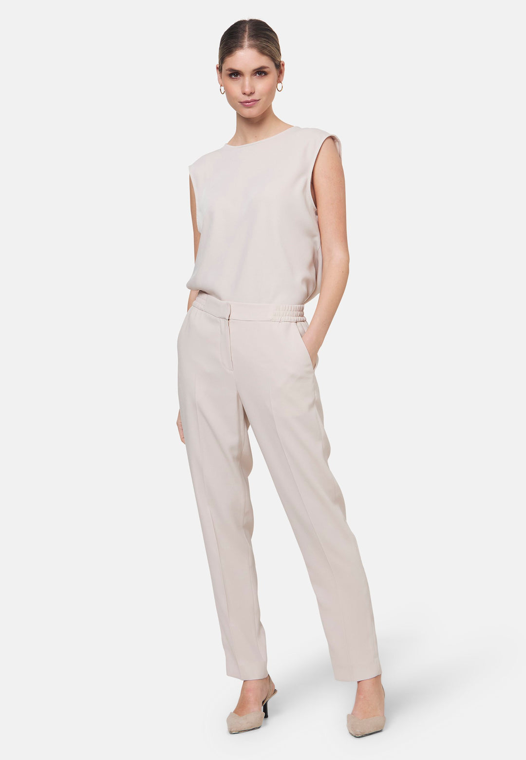 Woman wearing natural pearl pants