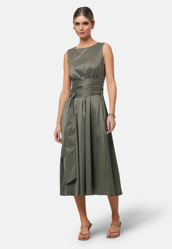 Introducing Avril, a sleeveless dress showcasing a tie waist and flattering empire line silhouette that gracefully skims the body, culminating in a chic mid-calf hemline. Perfect for holiday getaways, summer soirees and wedding events.