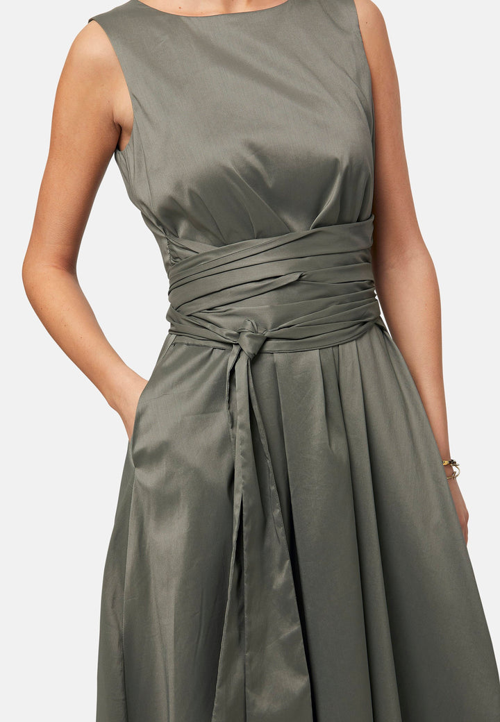 Introducing Avril, a sleeveless dress showcasing a tie waist and flattering empire line silhouette that gracefully skims the body, culminating in a chic mid-calf hemline. Perfect for holiday getaways, summer soirees and wedding events.