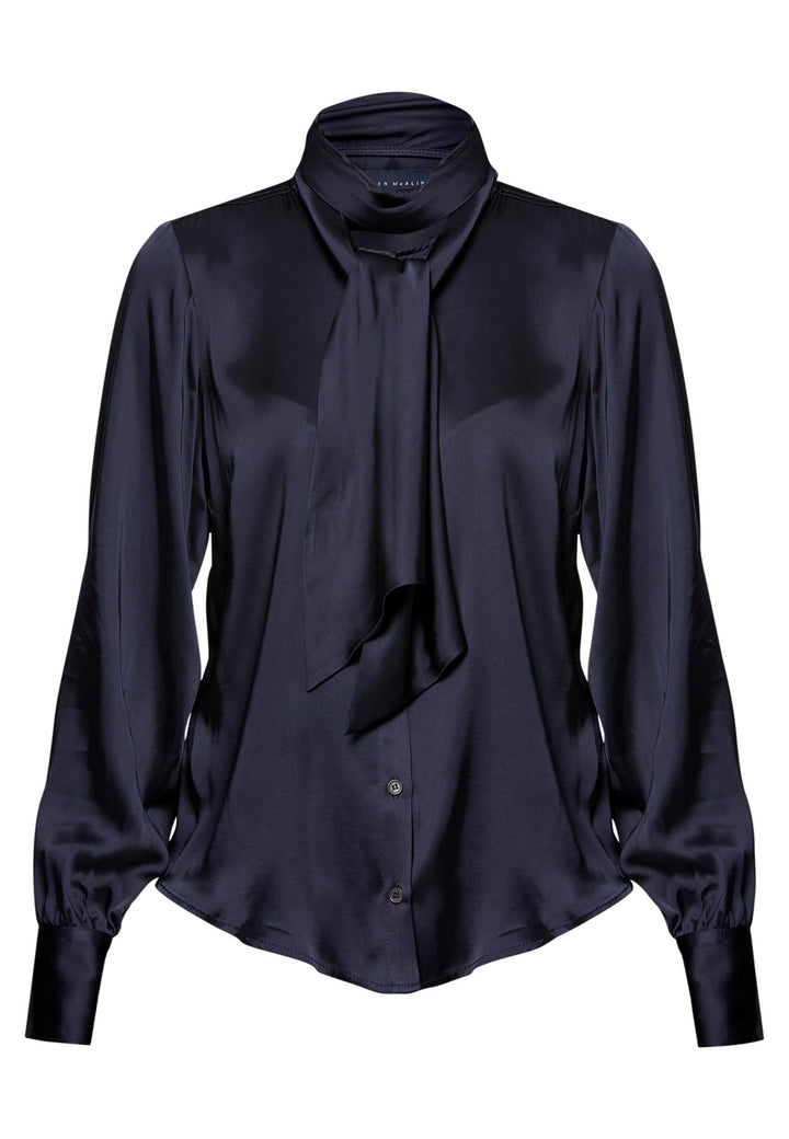 Navy blue blouse with a tie neckline on a white background
