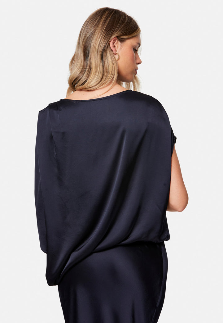 woman wearing navy satin assymetric blouse