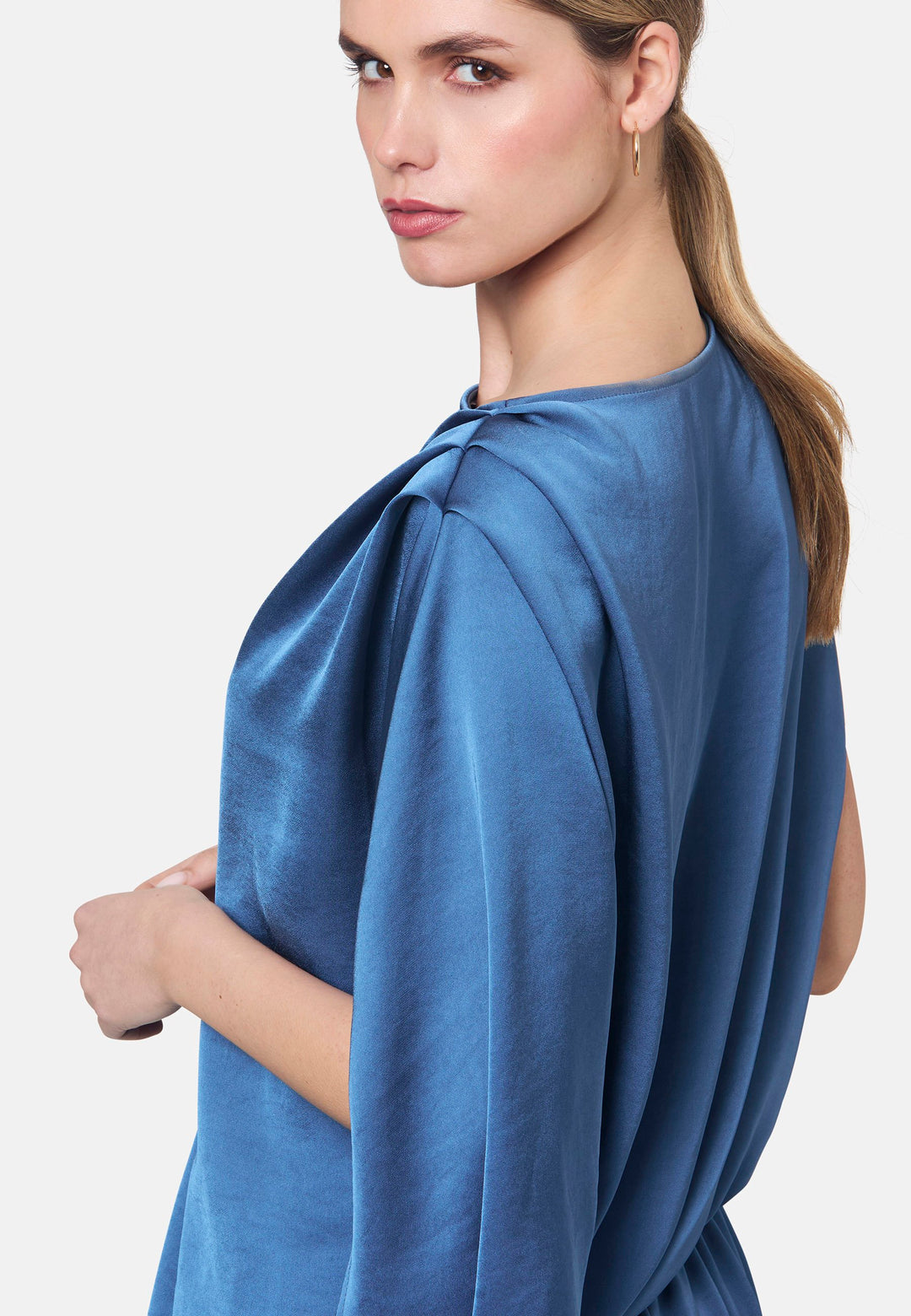 Woman wearing silk-touch satin in storm blue blouse