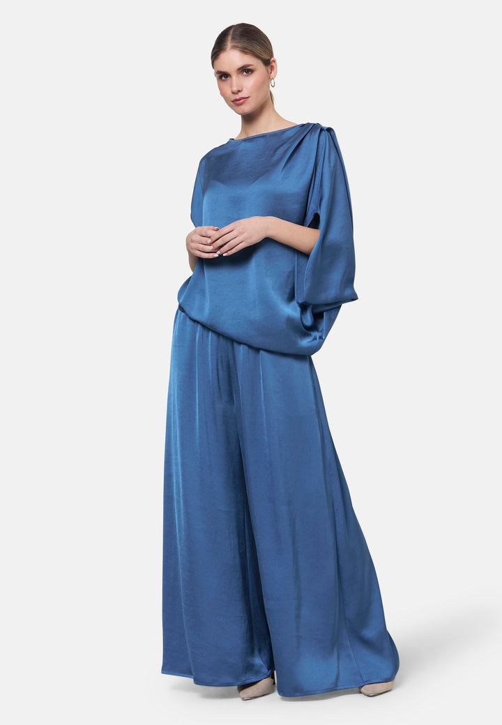 Woman wearing silk-touch satin in storm blue blouse