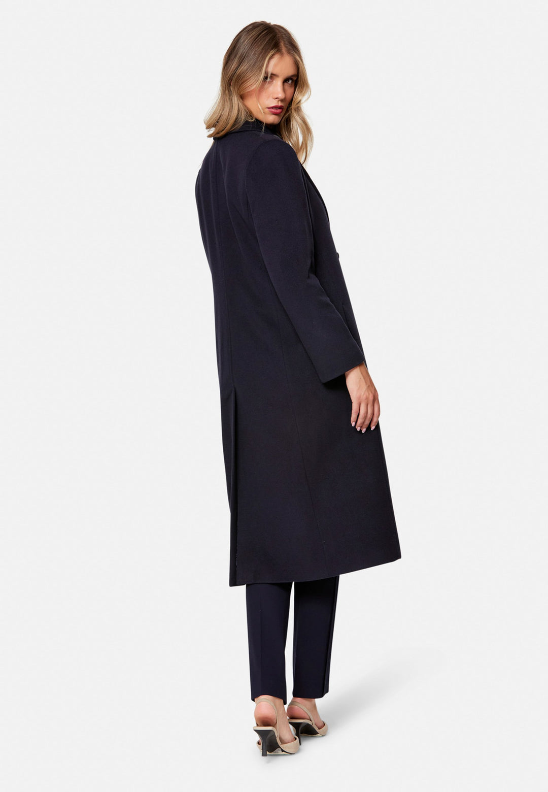 woman wearing double breast cashmere coat in navy