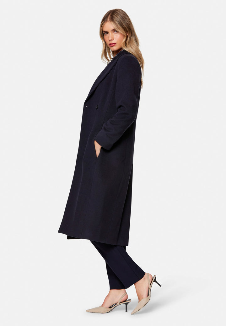 woman wearing double breast cashmere coat in navy