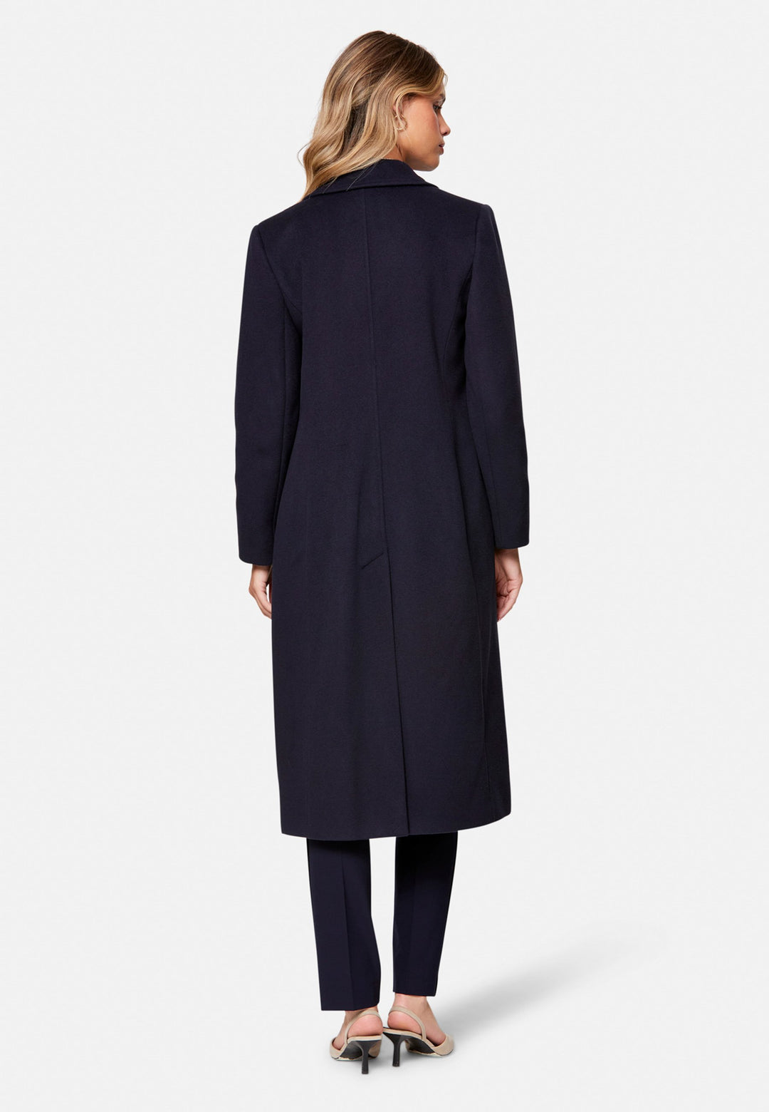 woman wearing double breast cashmere coat in navy