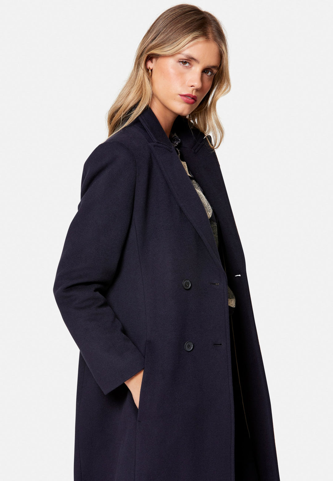 woman wearing double breast cashmere coat in navy